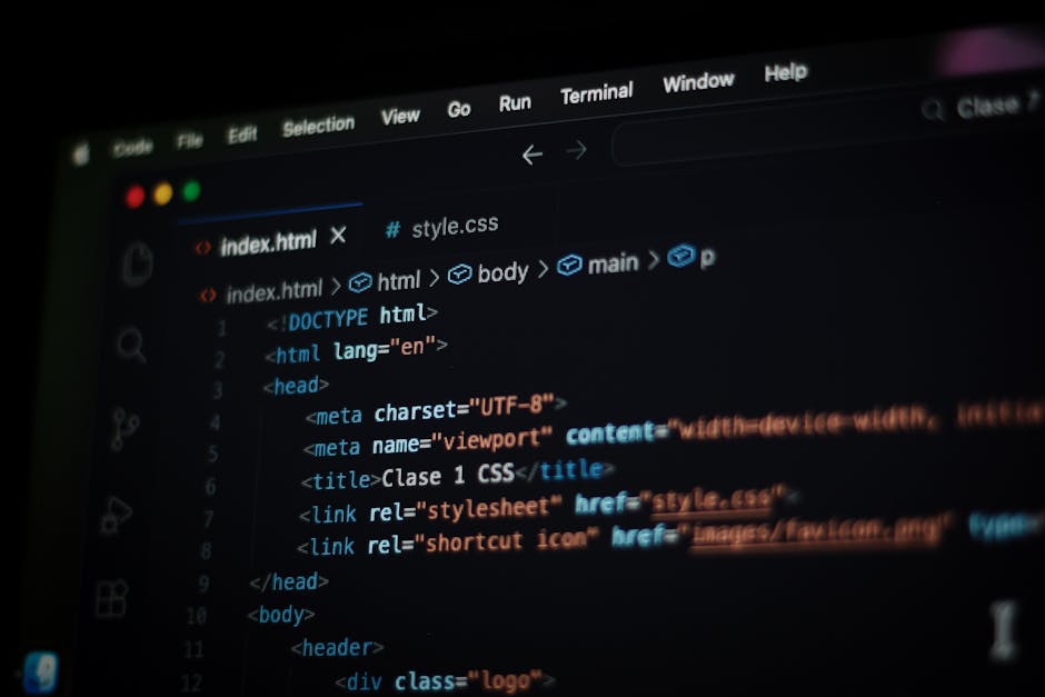 The image displays a close-up of a computer monitor showing lines of programming code in a text editor. The code includes syntax highlighting with various colors such as green, red, blue, and purple, 